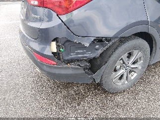 2016 Hyundai Santa Fe, VIN 5XYZU3LB8GG361250. Zdjęcie 6 z 6 z aukcji IAAI. Katalog aut z USA OpenDataCar.