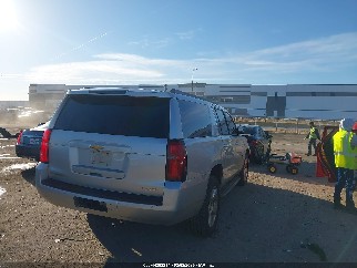 2015 Chevrolet Suburban 1500, VIN 1GNSCJKC4FR292566. Photo 4 of 6 from IAAI auction. OpenDataCar US salvage catalog.