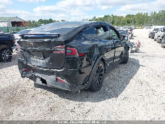 2023 Tesla Model X, VIN 7SAXCBE54PF381405. Фото 4 из 6 с аукциона IAAI. Каталог авто из США OpenDataCar.