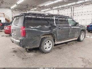 2015 Chevrolet Suburban 1500, VIN 1GNSKJKC2FR606136. Photo 4 of 6 from IAAI auction. OpenDataCar US salvage catalog.