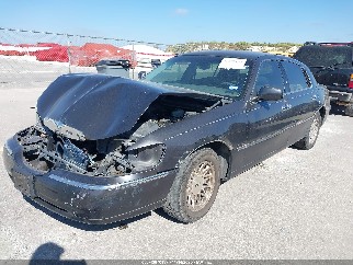 1999 Lincoln Town Car, VIN 1LNHM82W1XY662927. Фото 2 з 6 з аукціону IAAI. Каталог авто зі США OpenDataCar.