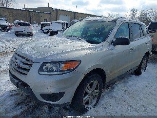 2012 Hyundai Santa Fe, VIN 5XYZGDAB7CG164838. Zdjęcie 2 z 6 z aukcji IAAI. Katalog aut z USA OpenDataCar.