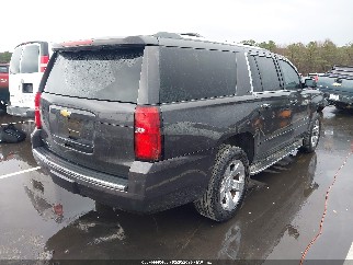 2015 Chevrolet Suburban 1500, VIN 1GNSKKKC8FR503664. Photo 4 of 6 from IAAI auction. OpenDataCar US salvage catalog.