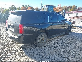 2015 Chevrolet Suburban 1500, VIN 1GNSKJKC3FR636200. Photo 4 of 6 from IAAI auction. OpenDataCar US salvage catalog.