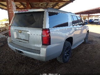 2015 Chevrolet Suburban 1500, VIN 1GNSKJKC3FR181980. Photo 4 of 6 from IAAI auction. OpenDataCar US salvage catalog.