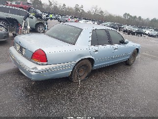 2000 Ford Crown Victoria, VIN 2FAFP71W7YX142429. Фото 4 з 6 з аукціону IAAI. Каталог авто зі США OpenDataCar.