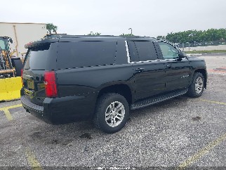 2016 Chevrolet Suburban, VIN 1GNSCHKCXGR211385. Photo 4 of 6 from IAAI auction. OpenDataCar US salvage catalog.