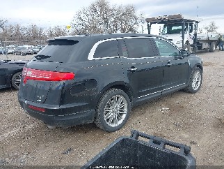 2014 Lincoln MKT, VIN 2LMHJ5AT2EBL53724. Фото 4 из 6 с аукциона IAAI. Каталог авто из США OpenDataCar.