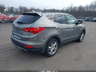 2013 Hyundai Santa Fe, VIN 5XYZU3LA8DG002869. Zdjęcie 4 z 6 z aukcji IAAI. Katalog aut z USA OpenDataCar.
