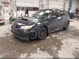 2012 Subaru Impreza, VIN JF1GR7E65CG229785. Фото 2 з 6 з аукціону IAAI. Каталог авто зі США OpenDataCar.